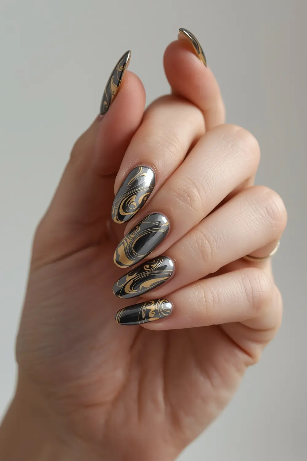 2. Molten Metal Marble: Gold & Gunmetal Swirl